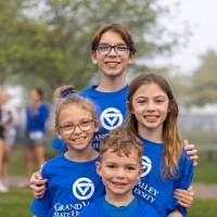 A group of children posing for a photo prior to the event